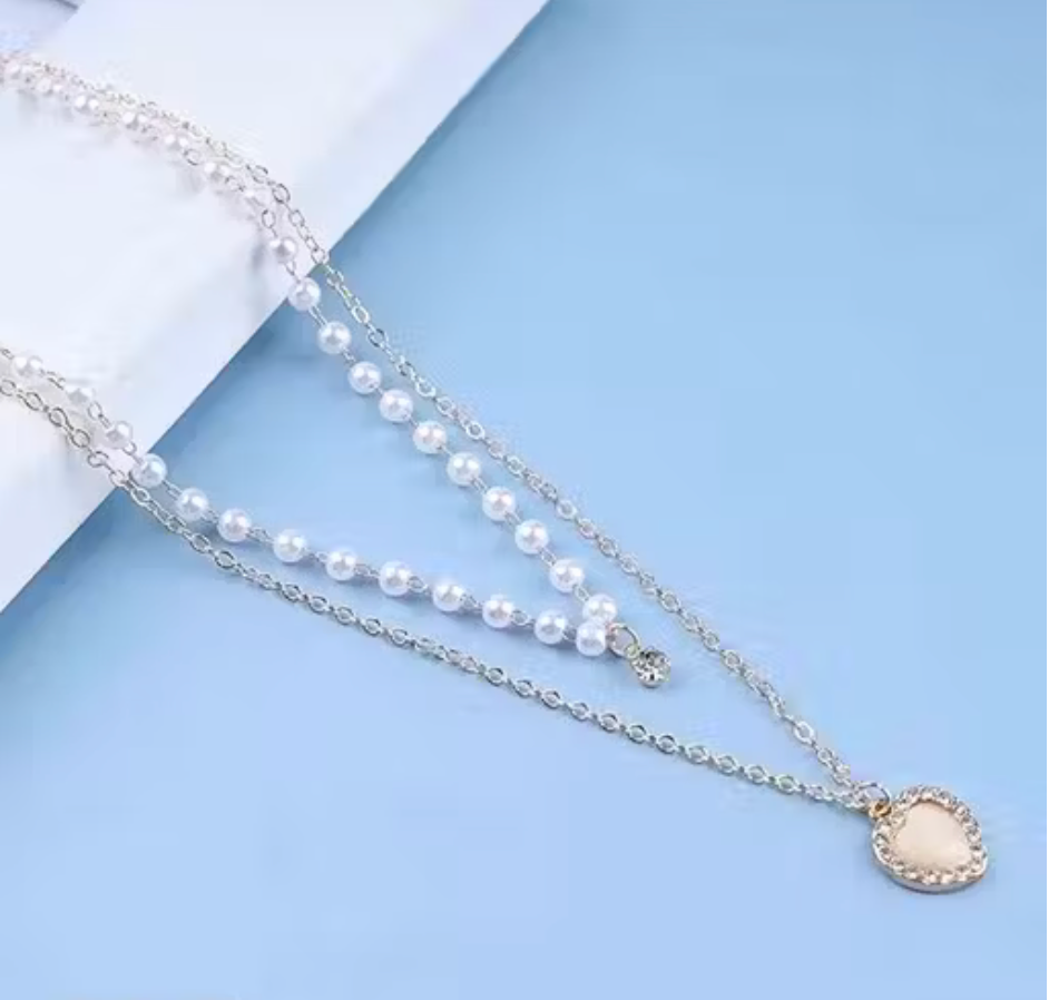 Combo of 2 Trendy Heart Pendant Necklace & Long Crystal Bow Drop Earrings